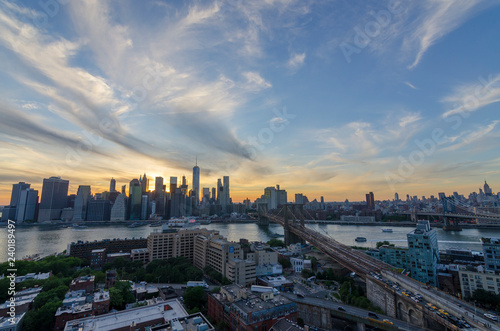 sunet brooklyn bridge views with lower manhattan and empire state building including 59th street bridge