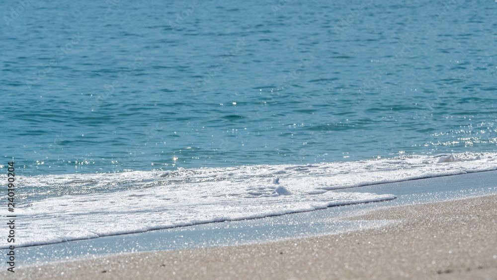 Ocean surf on the sandy beach Ocean surf on the sandy beach