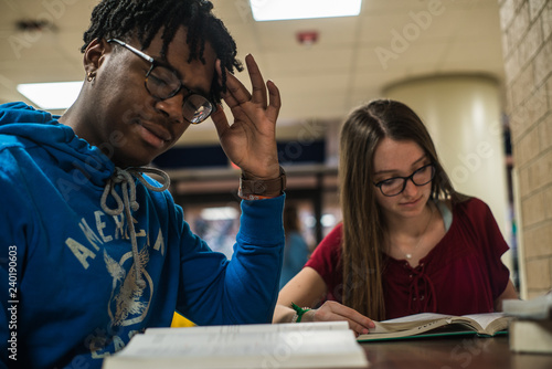 Diverse college students studying for exams closeup