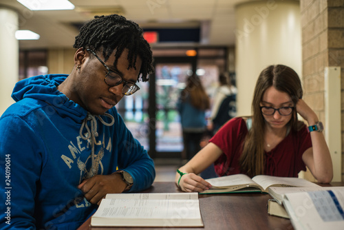 Diverse college students studying for exams