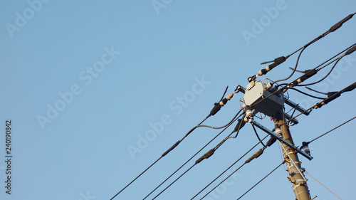 Tecnology of electric pole in Japan with blue sky background.