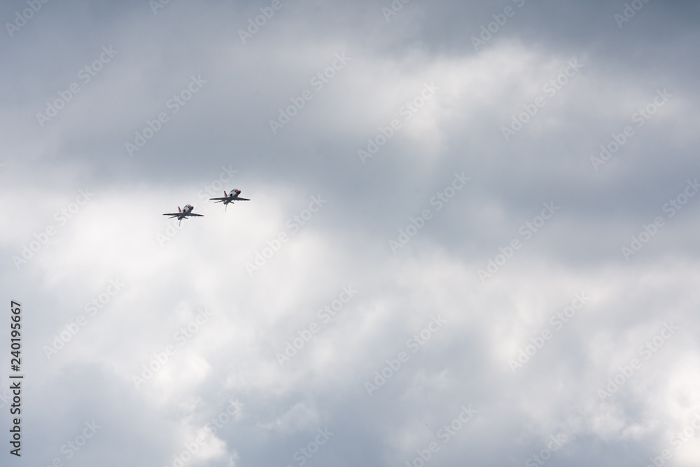 Two jets in clouds