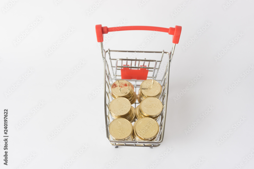 Coins on shopping cart.