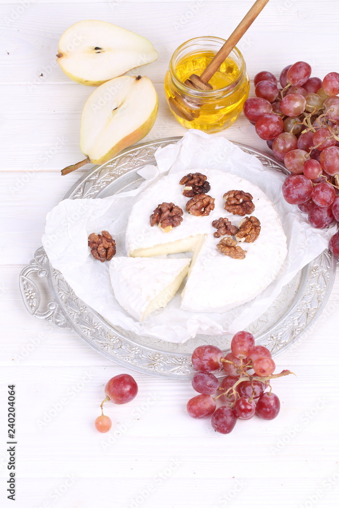 Camembert cheese with grapes Camembert cheese with grapes
