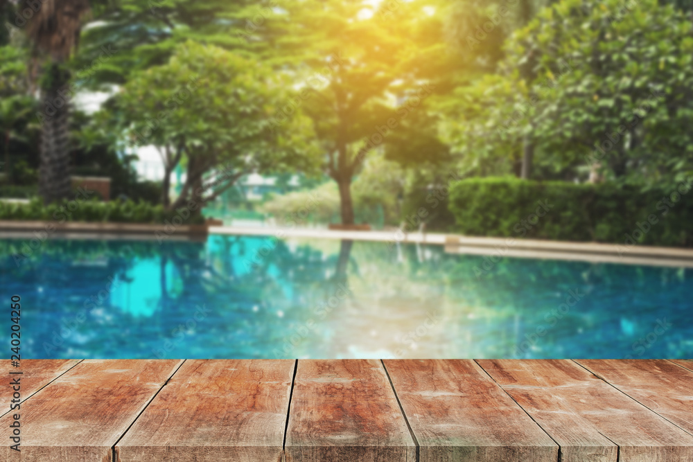 Wood walk Outdoor in ground residential swimming pool.