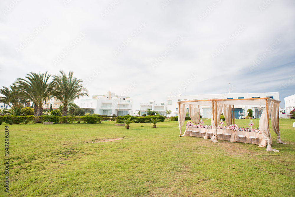 Wedding Setup. Modern Hotel with Green Palms and Grass. Wedding Setup. Modern Hotel with Green Palms and Grass.