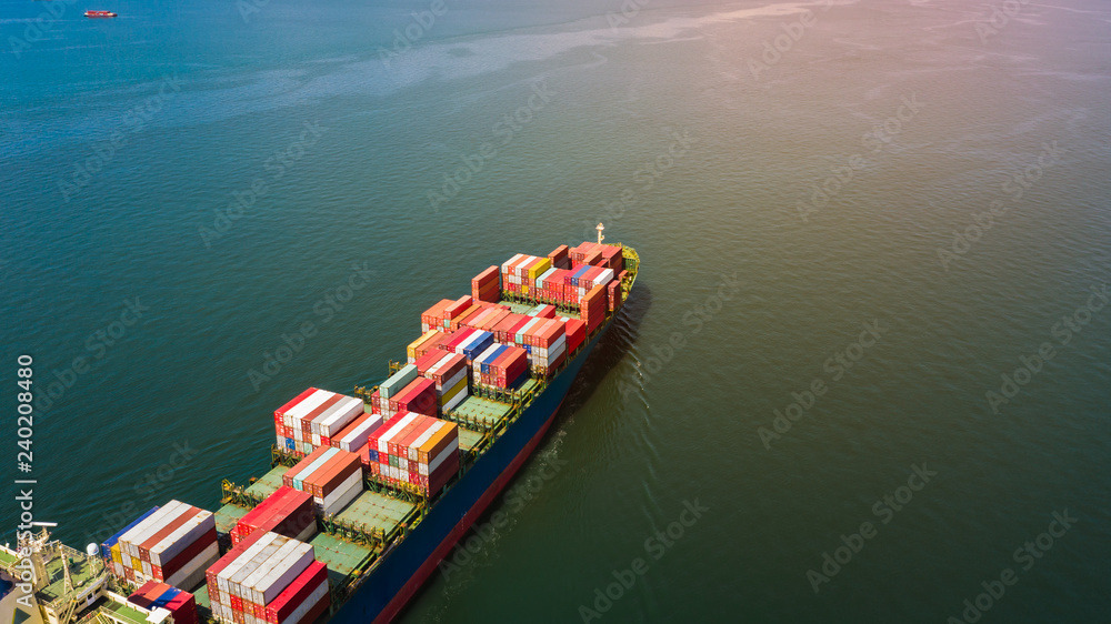 shipping container cargo business international inport ans export consumer product open sea aerial view