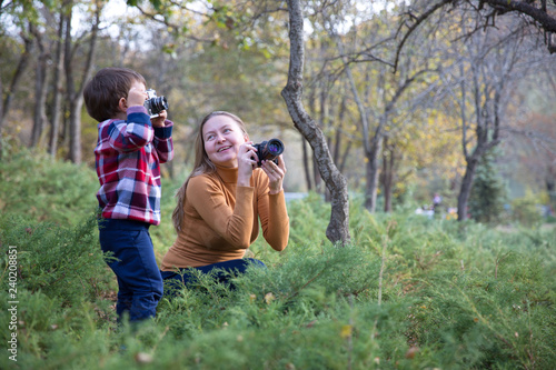 Mother and Son taking Photo in nature