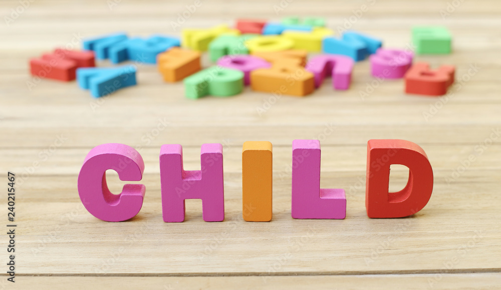 Obraz premium Colorful Word ' CHILD ' on Wooden Table, Learning English Language