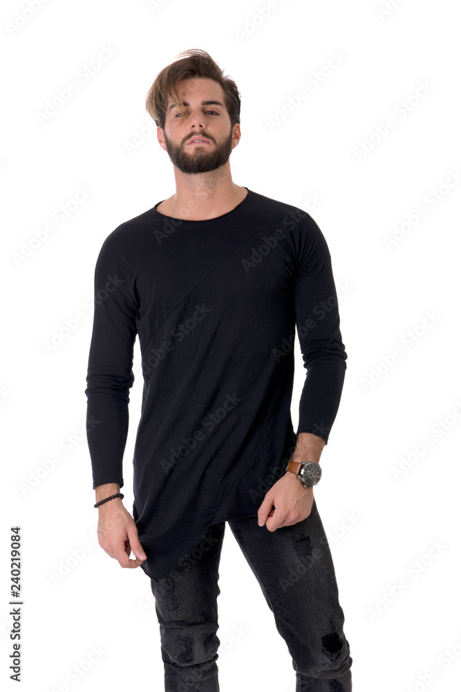 Three quarters shot of handsome young man with black shirt, looking at camera, on light background Three quarters shot of handsome young man with black shirt, looking at camera, on light background