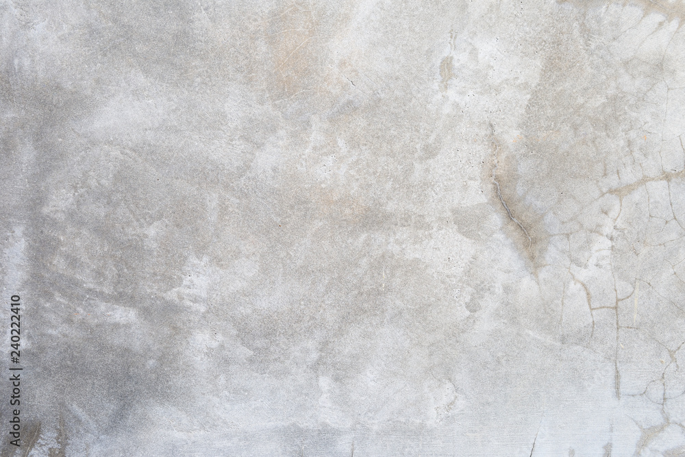 Grey cement wall texture background, blank grey background, natural crack pattern on concrete wall Grey cement wall texture background, blank grey background, natural crack pattern on concrete wall