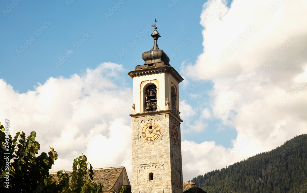 Clocktower with mountains and clouds