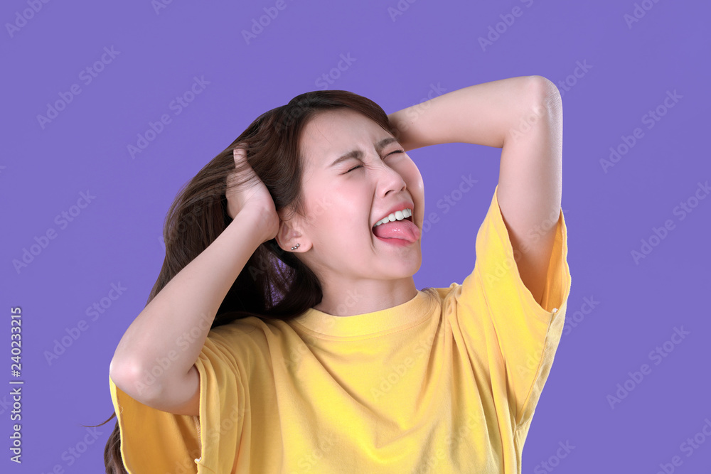 Asian woman unhandled with spicy food, yellow t-shirt clothing, purple background Asian woman unhandled with spicy food, yellow t-shirt clothing, purple background