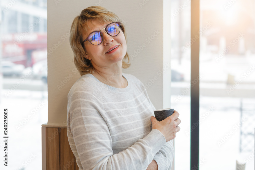 middle-aged woman business in workplace in cafe, office middle-aged woman business in workplace in cafe, office
