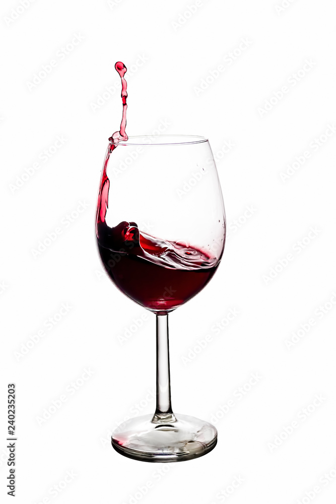 A Toast with Red Wine. Splash, white background. Splashing red wine on balloon glasses A Toast with Red Wine. Splash, white background. Splashing red wine on balloon glasses
