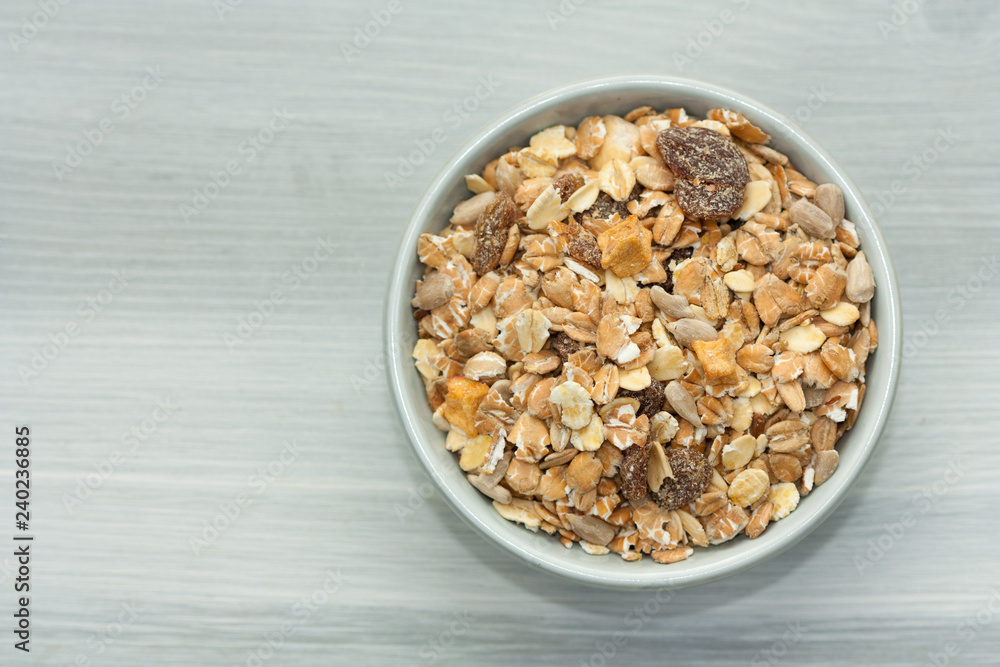 Bowl of muesli on wooden backgound. Bowl of muesli on wooden backgound.