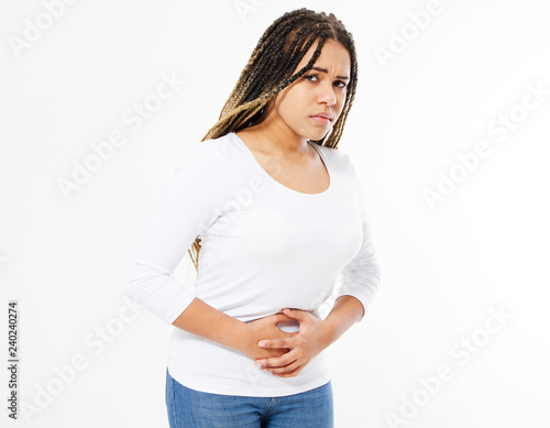 afro american woman having painful stomachache on white background.Chronic gastritis. Abdomen bloating concept.