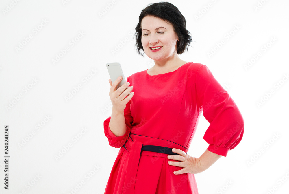 portrait brunette in red dress having сhat text conversation and holding phone portrait brunette in red dress having сhat text conversation and holding phone