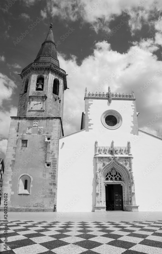Main square of medieval town Tomar (Portugal). Church of Saint John the Baptist. Black and white photo.