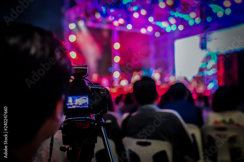silhouette videographer had been recorded to blurred and bokeh countdown concert., Bangkok, Thailand. photo