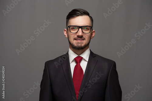 Close-up - serious businessman or manager in glasses looks at the camera. Copyspace © pavel_shishkin