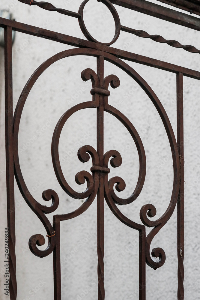 Fragment of a wrought-iron gate with an openwork pattern Fragment of a wrought-iron gate with an openwork pattern