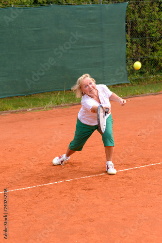 Senior woman playing tennis © michaelheim