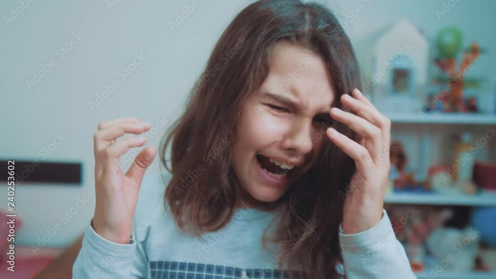 schoolgirl covering her face with her hands. emotion depression concept children. Shocked panic little girl screaming in despair and frustration. girl teenager screams opened her mouth lifestyle upset schoolgirl covering her face with her hands. emotion depression concept children. Shocked panic little girl screaming in despair and frustration. girl teenager screams opened her mouth lifestyle upset