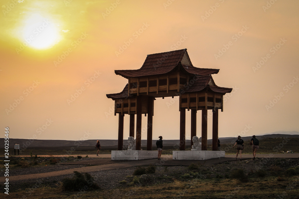 Kyzyl, Tuva, Russia - August 23, 2015: Buddhist gates in the Tuva steppe at sunset
