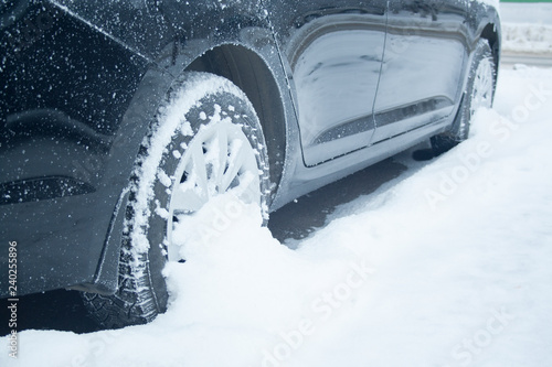 Wheel of car at snow