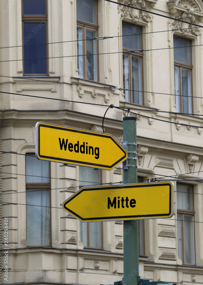 road signs with the arrow and the indications in erlin road signs with the arrow and the indications in erlin