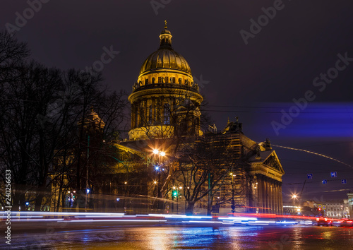 St. Isaac's Cathedral night, tracers from cars on the road in the foreground. Saint-Petersburg