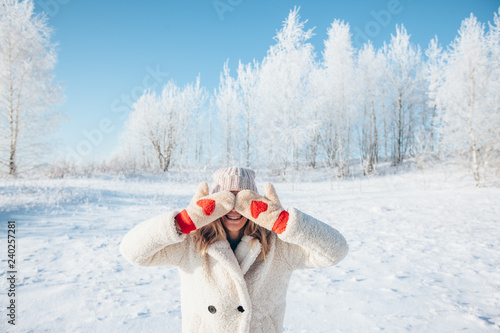 Woman in gloves in magic winter day