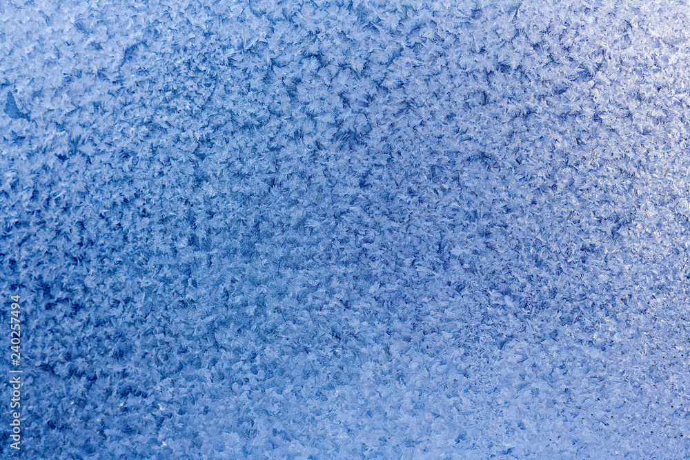 Winter blue background of snowflakes and frost Winter blue background of snowflakes and frost