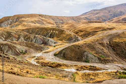 Dirt mountain road after the rain photo