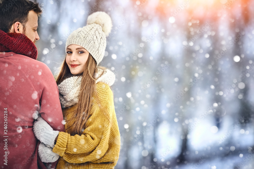 Happy Young Couple in Winter Park laughing and having fun. Family Outdoors. Copycpace. Happy Young Couple in Winter Park laughing and having fun. Family Outdoors. Copycpace.