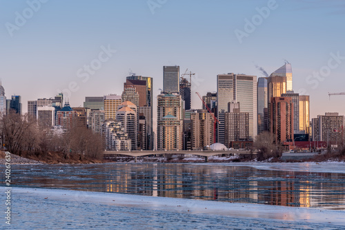 Calgary's skyline along the Bow River in winter.