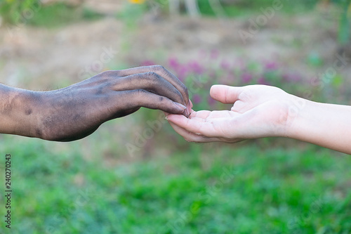 close up man and woman hands touching holding  together with a dirty hand and a clean  on blurred background for love concept valentine day, Stained © Thicha