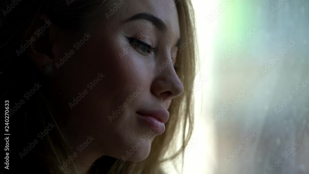 A beautiful woman is writing a message to her boyfriend, a blonde girl with full lips is sitting in a cozy room, a girl is typing a message and smiling, a satisfied girl in a white jacket, a love A beautiful woman is writing a message to her boyfriend, a blonde girl with full lips is sitting in a cozy room, a girl is typing a message and smiling, a satisfied girl in a white jacket, a love