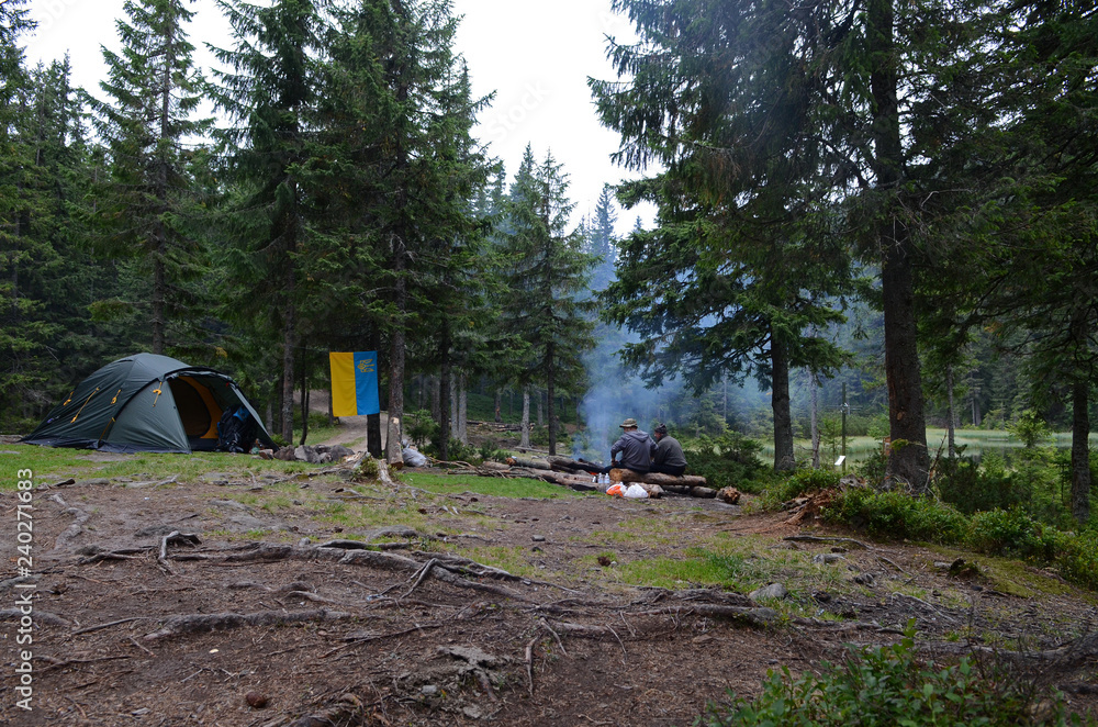 Camping in the mountains on the shore of a mountain lake Camping in the mountains on the shore of a mountain lake
