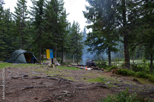 Camping in the mountains on the shore of a mountain lake © Nataliia