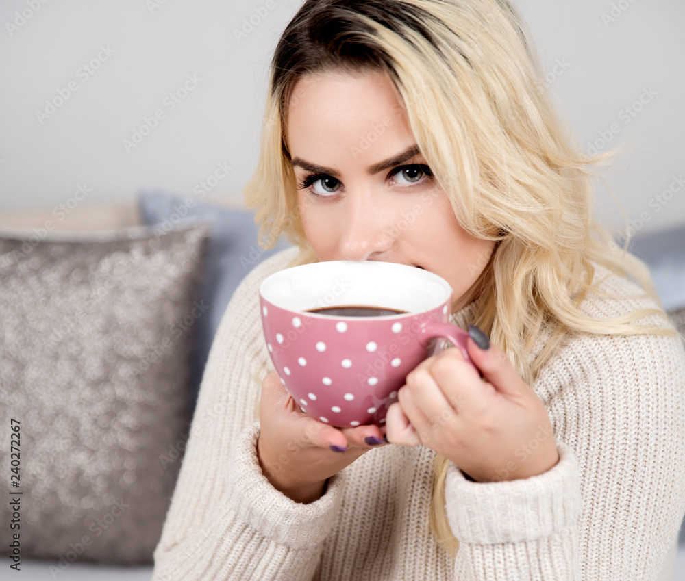 Young woman drinking coffee at home Young woman drinking coffee at home