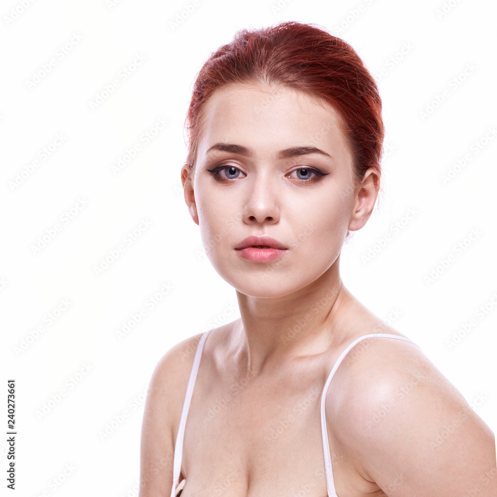 Beautiful face of young adult woman with clean fresh skin - isolated on white