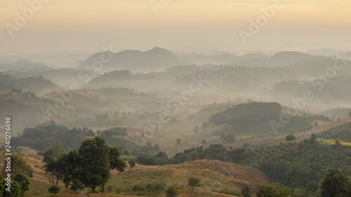 Mountain view misty morning of the hill with colorful sunlight in the sky background  sunrise at Doi Mae Salong  Chiang Rai  Thailand.
