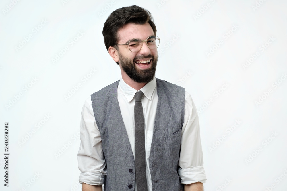 Handsome spanish man winking and smiling. Positive human emotion. Handsome spanish man winking and smiling. Positive human emotion.