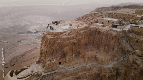 Masada fortress area Southern District of Israel Dead Sea area Southern District of Israel. Ancient Jewish fortress of Roman Empire on top of a rock in the Judean desert. front view from the air 4k