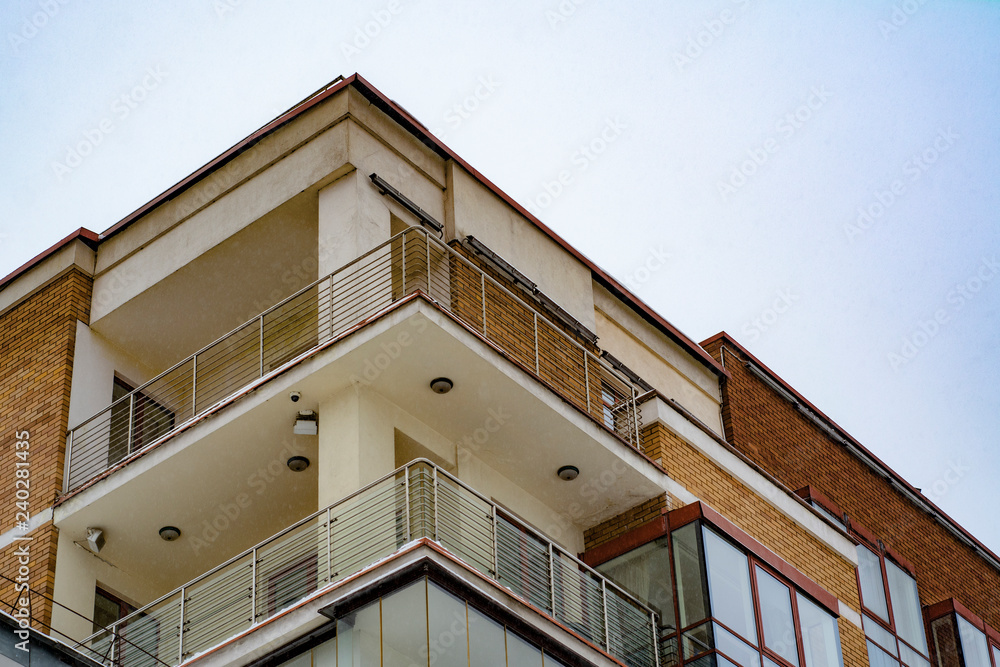 The facade of a modern building on the background of a winter sky The facade of a modern building on the background of a winter sky