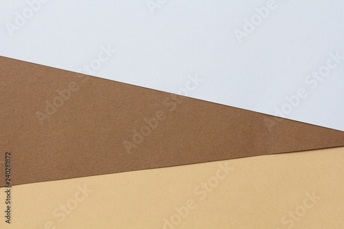 Colored cardboards background in blue and brown. Copy space.