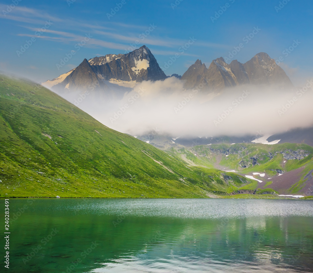 Naklejka premium emerald lake among a mountain valley