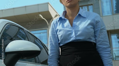 Businesslady getting out of car dropping phone and throwing papers, hateful work